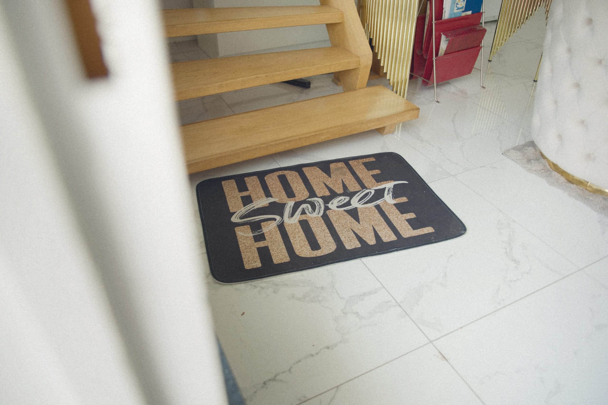 Doormat reading Home sweet home in a villa hallway