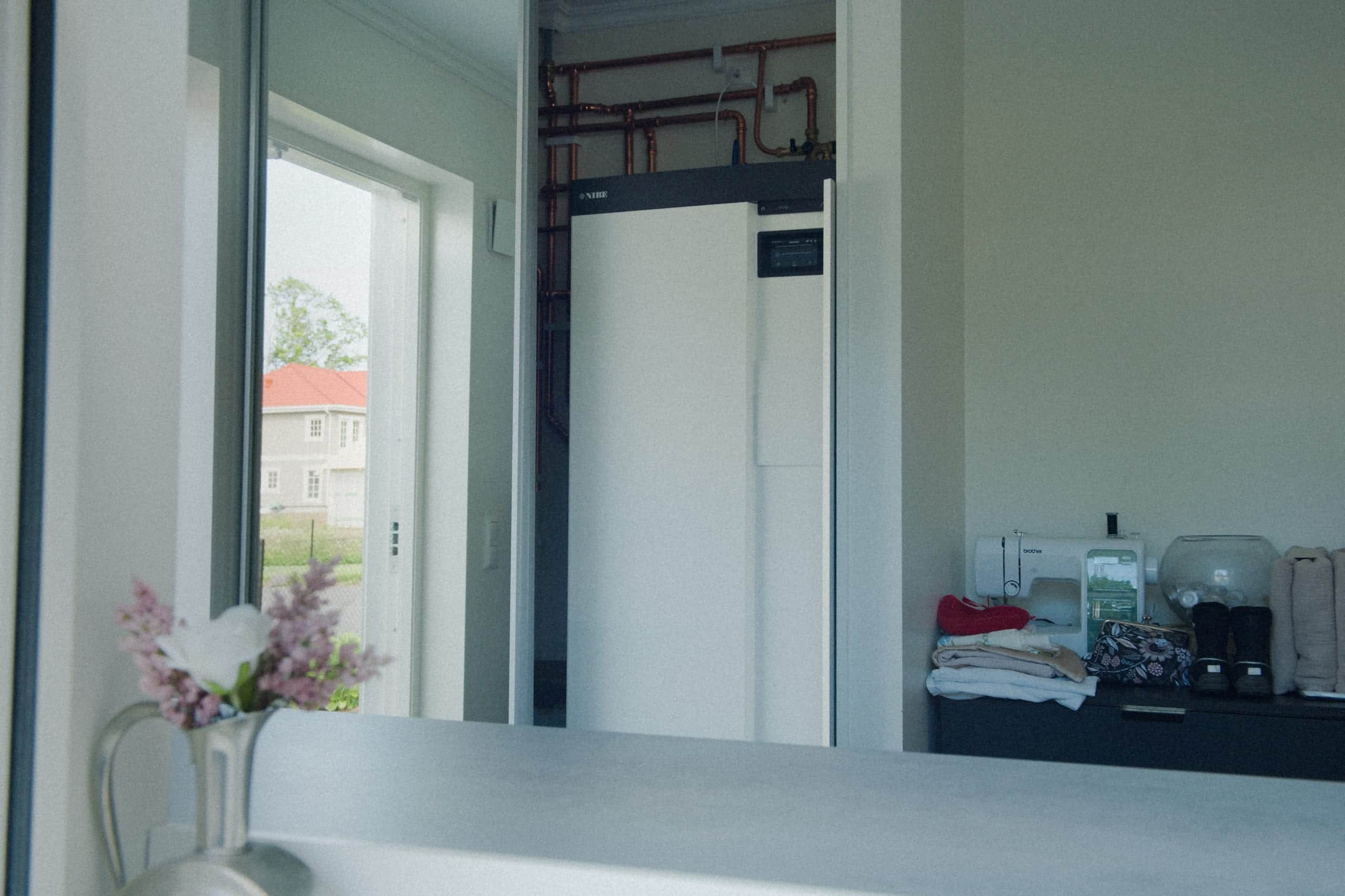 Elvy heat pump indoors by a window