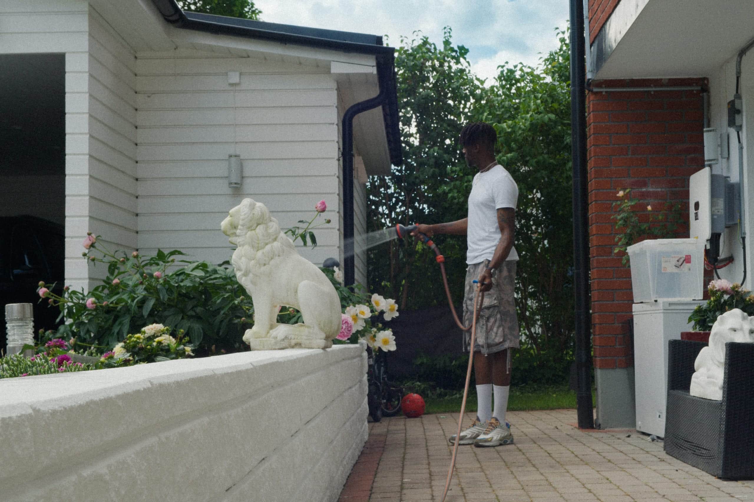 Watering the garden at a house